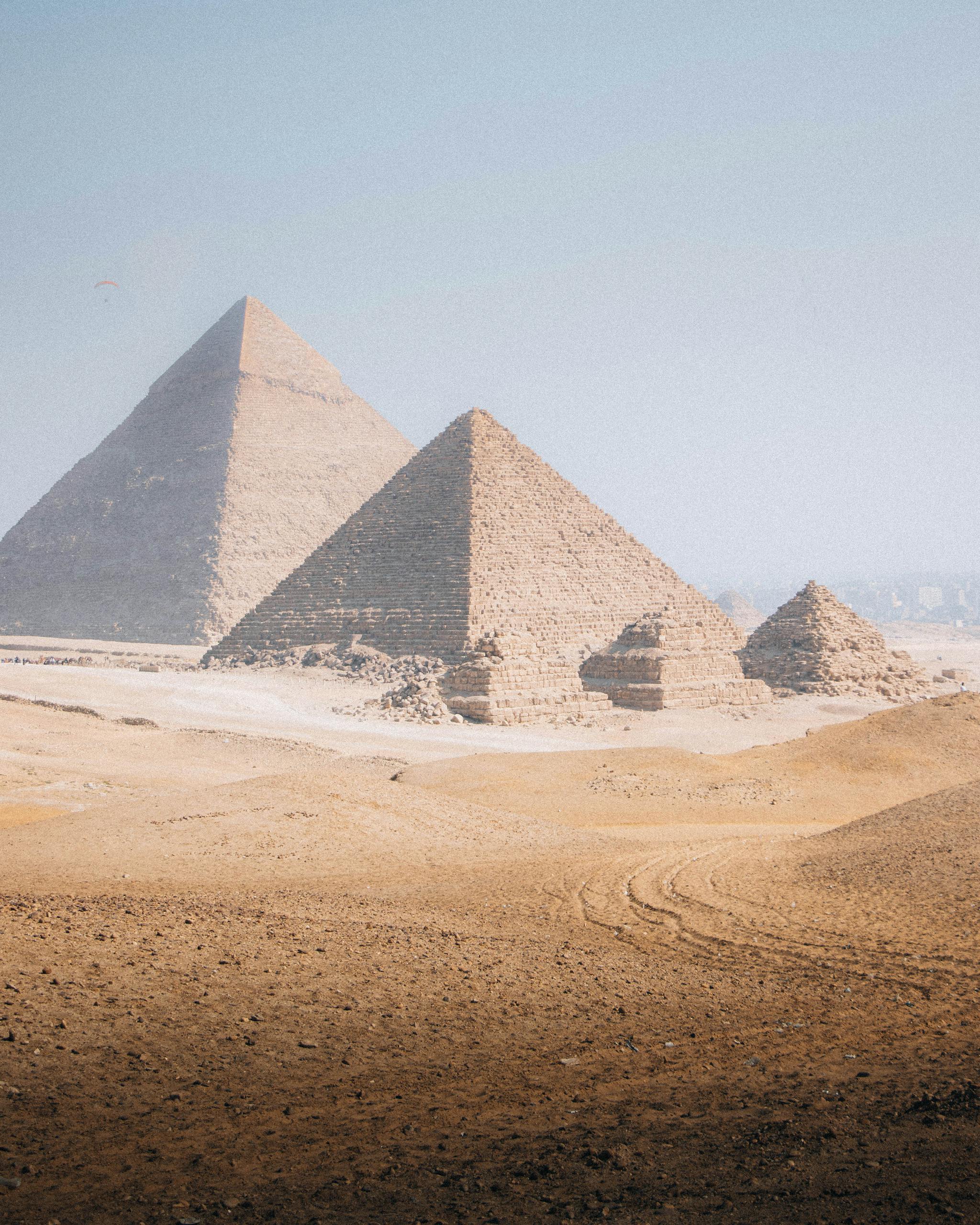 Breathtaking view of the Great Pyramids under a clear sky in Cairo, Egypt.